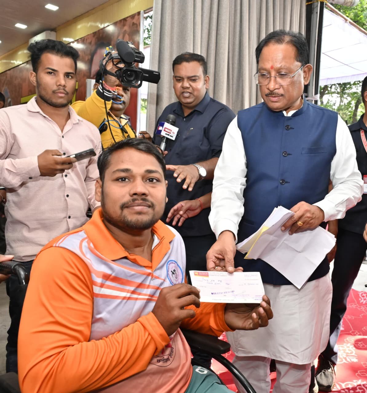 Disabled rugby player Pintu Ram Sahu receives Rs 90,000 from the Chief Minister, to help purchase sports equipment and a wheelchair.