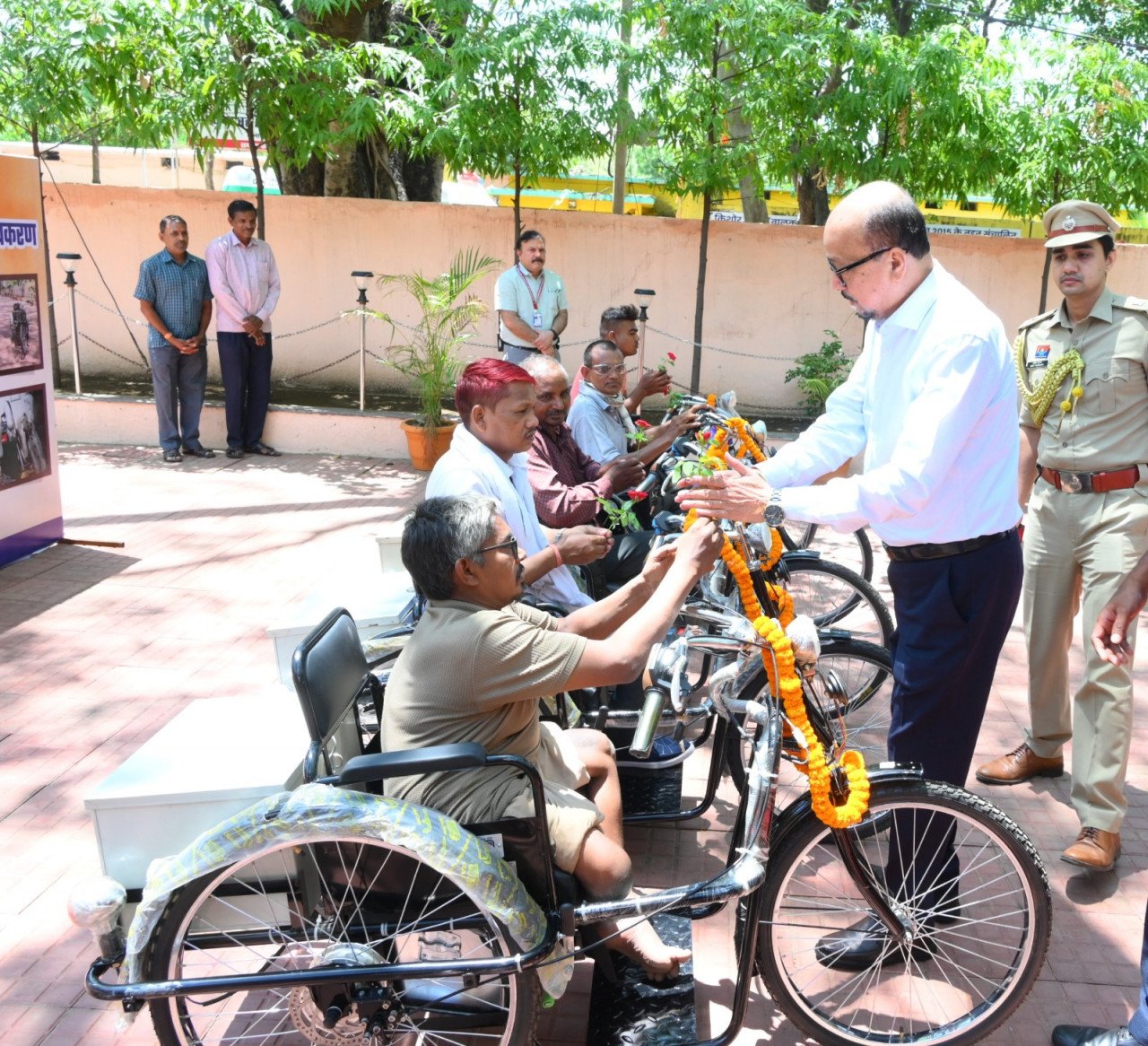 Governor Ramen Deka visited the Mana Camp and distributed tricycles to persons with disabilities; he also inspected the facilities at the rehabilitation center and the gait lab.
